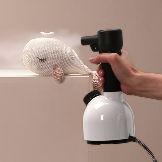 Spraying handheld steamer