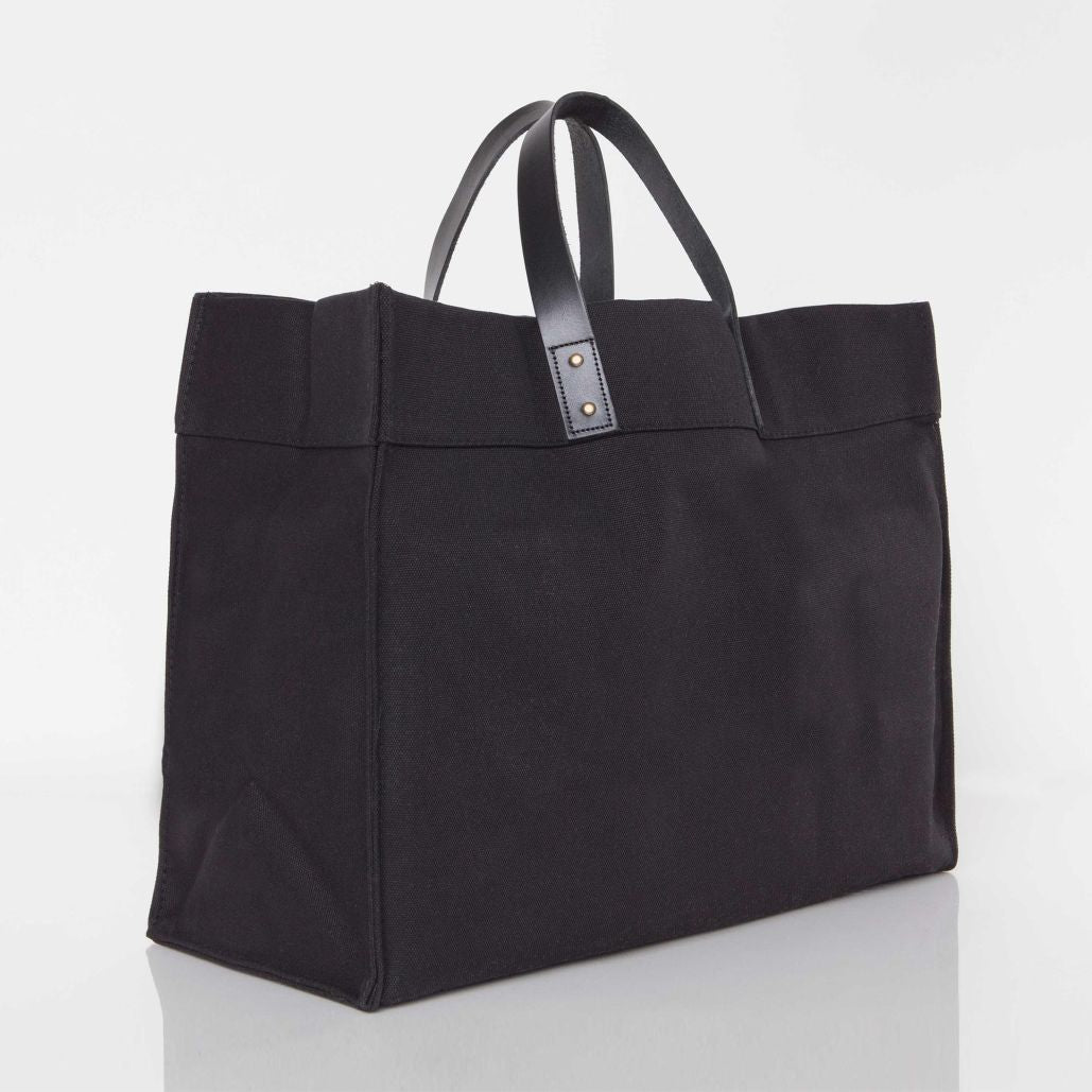 Canvas laundry tote with leather handle