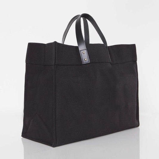 Canvas laundry tote with leather handle