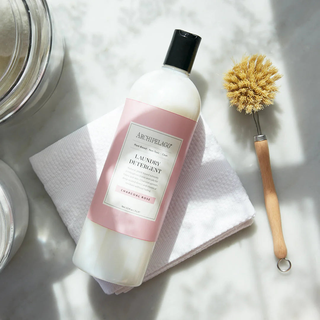 Archipelago Laundry Detergent Charcoal Rose and cleaning brush