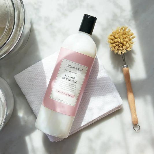 Archipelago Laundry Detergent Charcoal Rose and cleaning brush